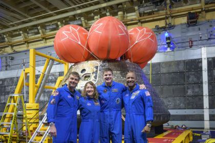 NASA astronauts Reid Wiseman, commander; left, Christina Koch, mission specialist; CSA (Canadian Space Agency) astronaut Jeremy Hansen, mission specialist; and NASA astronaut Victor Glover, Artemis II pilot, right, pose for a group photo after viewing the Orion spacecraft in the well deck of USS John P. Murtha, Saturday, April 11, 2026, in the Pacific Ocean off the coast of California. The quartet splashed down Friday, April 10 at 5:07 p.m. PDT (8:07p.m. EDT).