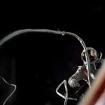 Gemini IX-A astronaut Gene Cernan is backdropped by the blackness of space during America’s second spacewalk on June 5, 1966. His umbilical drifts across the foreground, partially obscuring the view of the astronaut.