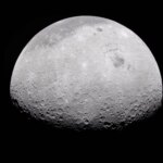 The Moon's rugged surface is on display in this image. Most of the Moon is visible, with the bottom of the sphere disappearing into the darkness. This line between light and dark is called the terminator. The terminator is lined with many craters.