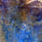 In this representative color image, Mars' surface appears in shades of red, orange, and blue. At right is a double-ring crater called Huygens. To