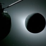 The Moon is backlit by the Sun. Earth is reflecting sunlight at the left edge of the Moon, which is slightly brighter than the rest of the disk; this light reveals a small sliver of the Moon's gray surface. The bright spot visible just below the Moon’s bottom right edge is Saturn. Beyond that, the bright spot at the right edge of the image is Mars. The Orion spacecraft is visible in the foreground on the left.
