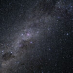 The Milky Way galaxy appears as many points of light dotting the blackness of space.