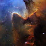 A rich, cosmic landscape is split in two. On the right side, clouds of reddish-black dust billow. On the left, stars sparkle across a dark-blue background.