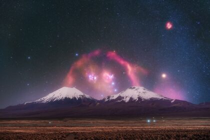 APOD: 2026 July 28 - Barnards Loop over Twin Volcanoes