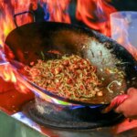 Why Does Chinese Food Catch Fire In The Wok? The Science Behind Those Dramatic Flames